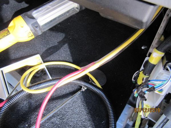 IM
Using the clear tube  insert the cable into the tube then pull the tube back out wire should remain in tube while pulling through grommet G 6225