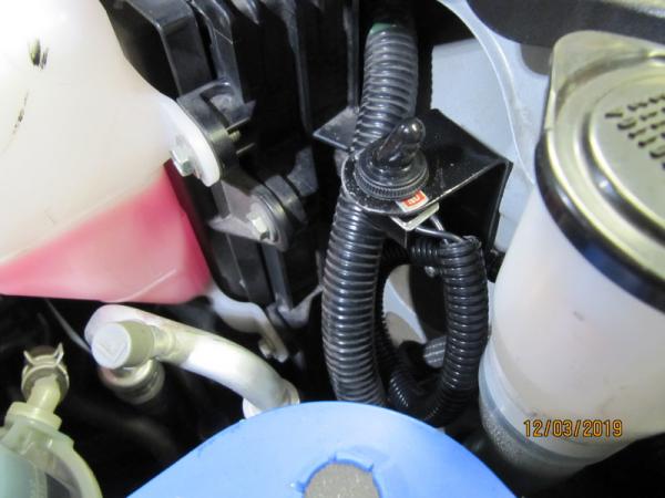 IMG 6911 Switch mounted near the wiper fluid tank filler. Fabricated a bracket from 16 gage steel cut filed painted drilled installed worked out OK