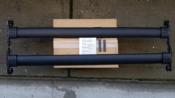 Initally bought OEM crossbars, but they didn't work. Thule box couldn't clear the shark fin.