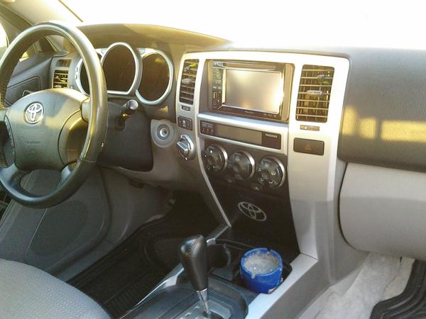 inside pioneer double din and custom Toyota logo on lower compartment