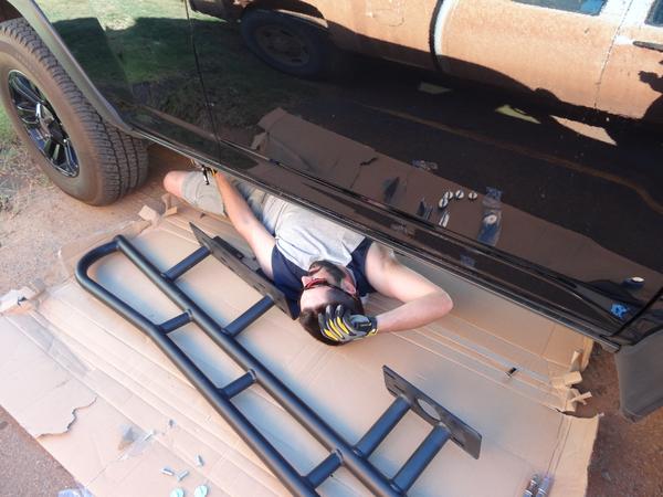 Installing BudBuilt Sliders in apartment parking lot. Summer in OK!