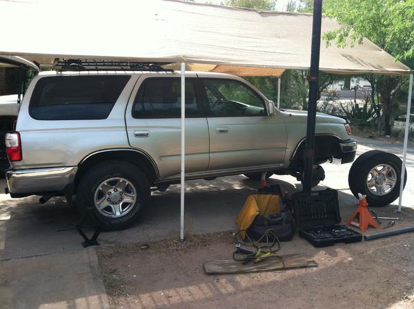 Installing coilovers.