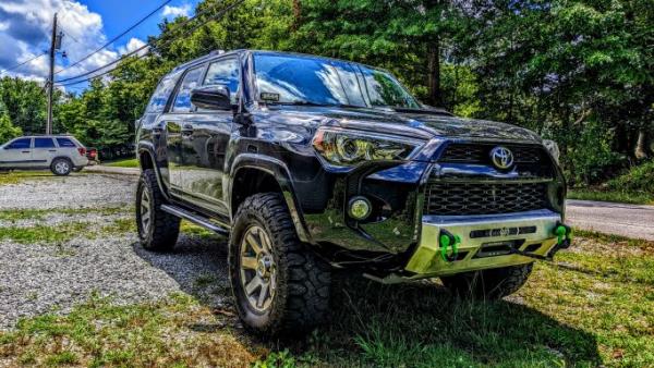 Ironman 4x4 Foam Cell Pro 2.5" lift, Milestar Patagonia 295 tires, Hefty Fabworks Banshee Bumper, Ironman 4x4 9500 lb. winch with synthetic line, Auxb