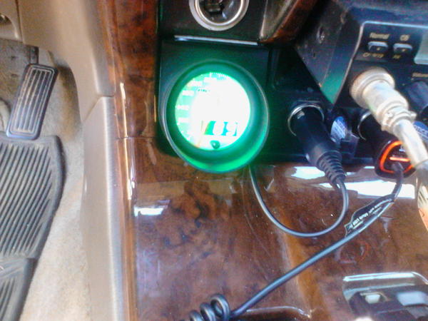 Lights up green. It's hard to get a good pic during the day. Looks sweet at night.  Also has dimmer wire with 3 settings. I didn't hook mine up.  Real