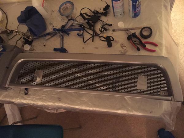 Made the appropriate cuts to fit the light bar mounts through the mesh.
