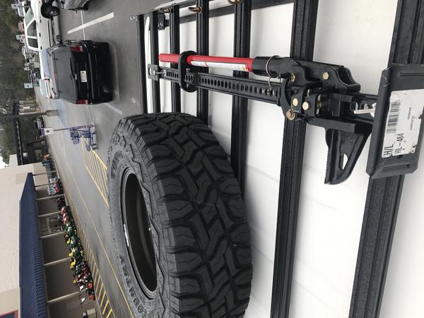 Matching spare and Hi-Lift mounted on the roof rack.