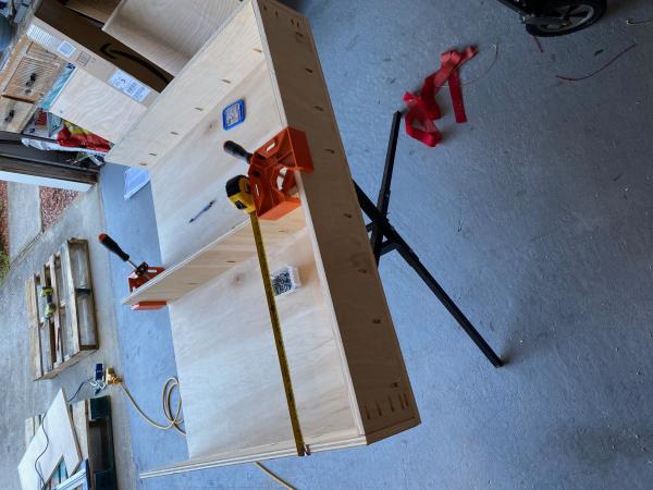 measuring and bracing the divider.  If I did this again, I would cut pieces of wood to use to brace where drawers go and ensure even fit.