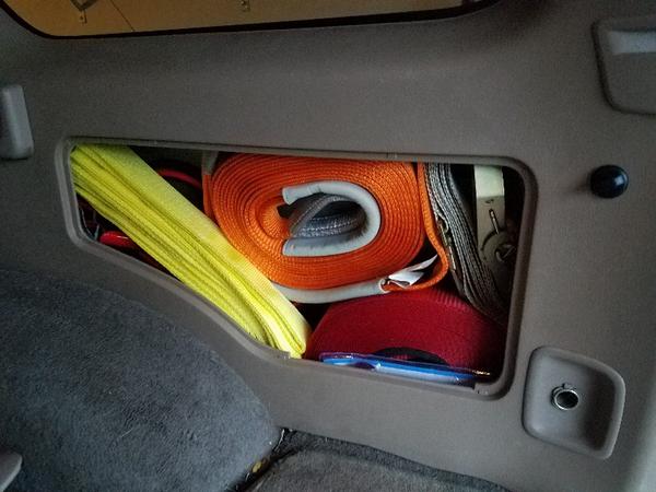 Modified cargo compartment! Fits my ARB Snatch strap, 65' winch extension, tree saver, jumper cables, and a 5000lb ratchet tie-down!