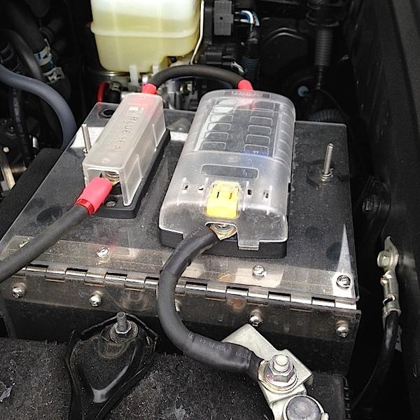 Mounted with hinges on top factory fuse block