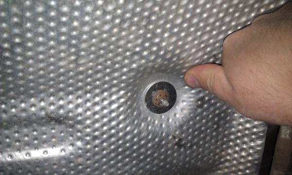 Muffler heat shield fixed with fender washers.