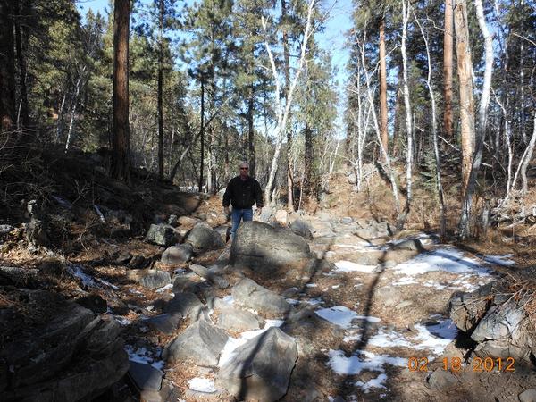 My brother behind one of the boulders on the heavy-hitter portion of the trail.