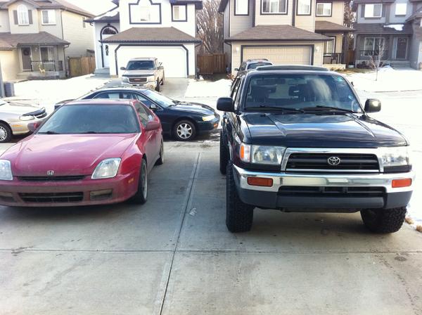My (dirty) 4th Gen Honda Prelude besides my 3rd Gen 4runner SR5 4x4. Both have Manual tranny - Its the only way i like to drive!