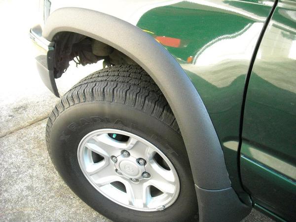 My fender flares painted with bedliner.