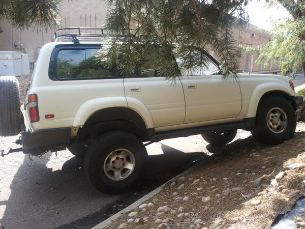 My other 80 series. Has OME lift. 315s for the tires. Kay-Mar rear bumper. Roof Rack. Yup, you only get this type of flex with a solid front and rear 