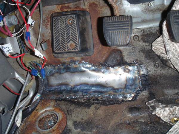 My patch work. Not the best in the world, but it'll hold. After I welded it, I cleaned it up and throw a fiberglass resin and cloth on top of it on th