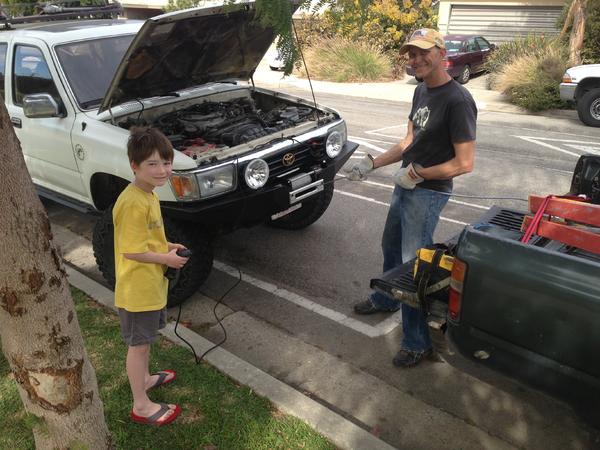 My step son helping to install the cable. Getting him started early and a co-driver