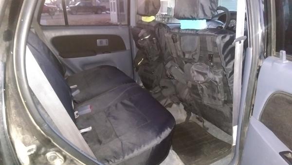 New custom seat covers and molle pouches! Recovered door panels too!