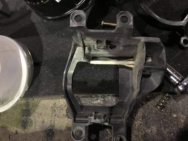OEM fog light mount removed/separated from light fixture.