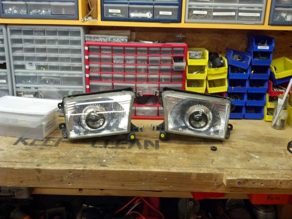 Once youve adjusted the aim of your projector go ahead and replace the glass covers onto the reflectors, if you are completely done, Jb weld the screw