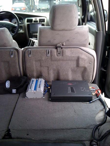 one of my amp. mounted to the back of the rear seat.