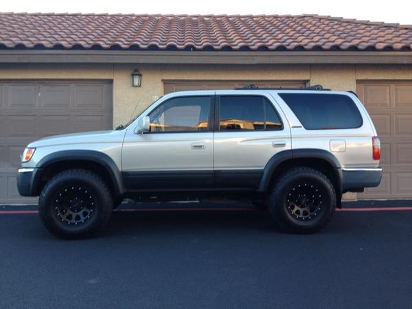 Painted fender flares and side panels flat black (before lift kit).