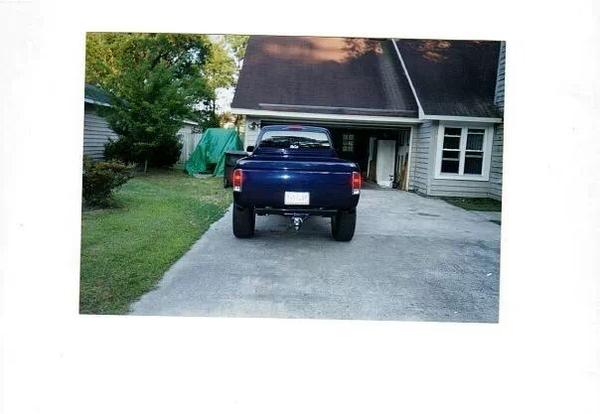 Picture of roll pan, taillights, and hitch on the 99 tacoma
