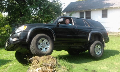 Playing on a stump after taking running boards and tow hitch off