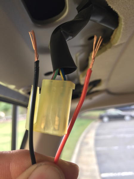 Positive cable tapped into the Blue/Yellow cable.  Negative cable tapped into the Green/Red cable.