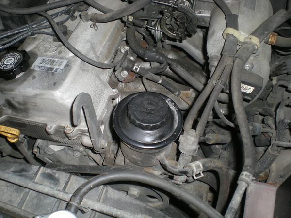 Power steering reservoir on the 3RZ-FE engine.