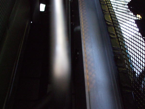 Prepared the support beam behind the bottom grille by covering it with carbon fiber tape.