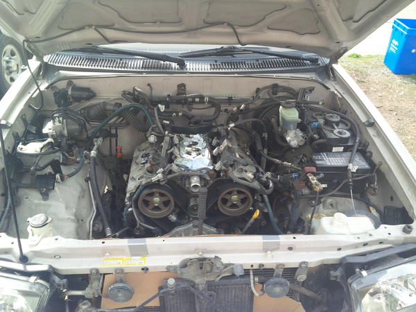 ready to pull! All mounting bolts cracked, all physical connections to the block detached, wiring harness detached, torque converter pushed back and A