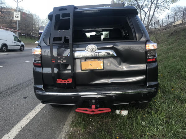 Rear-ended by a flatbed tow truck.