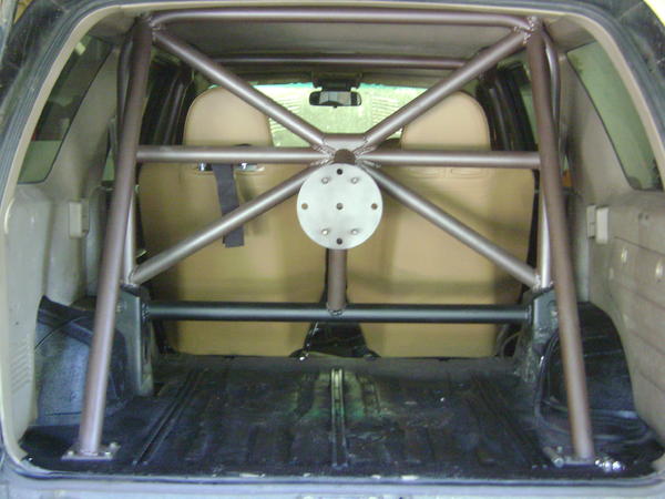 Rear portion of cage. C & D pillars, diagonal bracing, harness bars and spare tire mount.