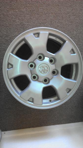 Refinished Tacoma sport wheel with center cap