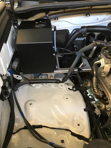 Relocating washer bottle and air pump