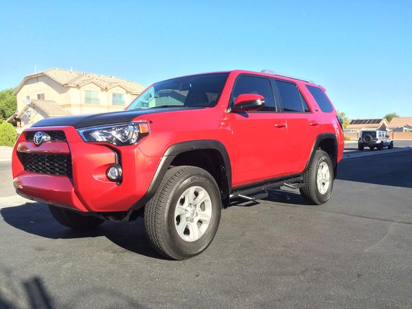 REMOVED PLASTI-DIPPED FENDERS AND USED VINYL WRAP FOR A MORE SEMI-PERMANENT LOOK.  2 INCH LIFT IN FRONT AND 1 INCH LIFT IN REAR