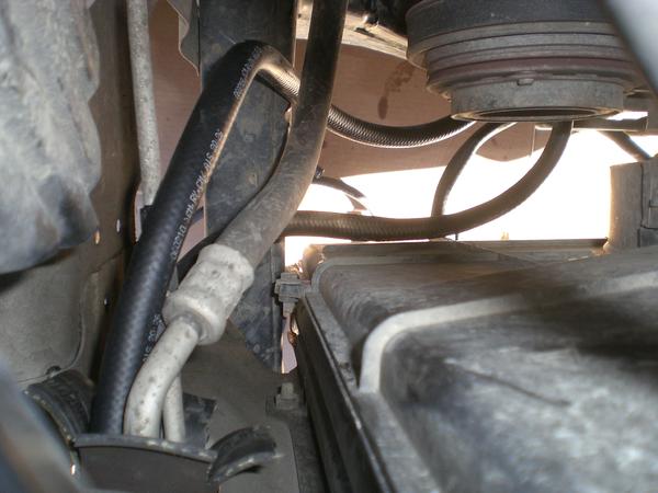 Routed the hoses through the bulkhead separating the front of the a/c condenser to the engine bay.