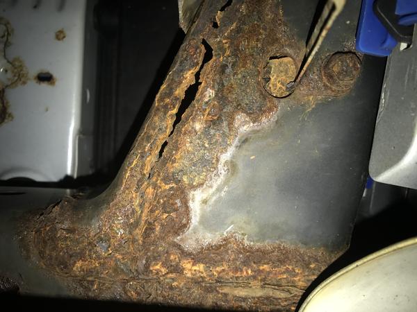 Rust hole at weld seam. Rear frame rail attaches to siderail