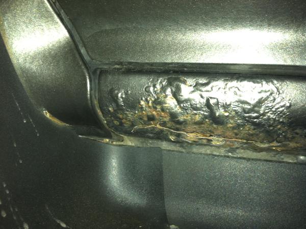Rust Removal on drivers side rocker panel(Before)
