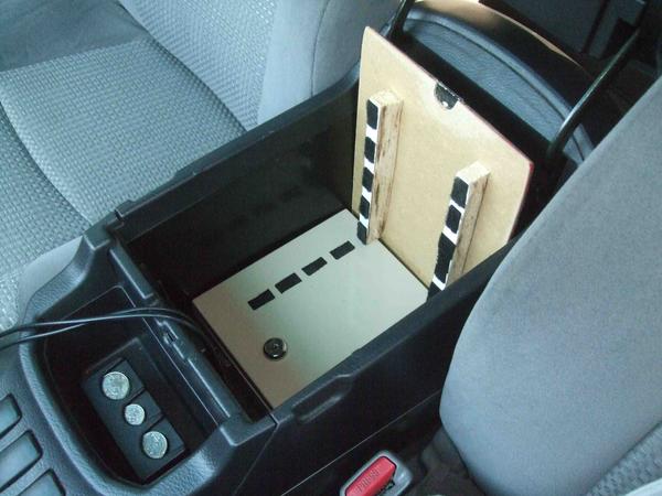 Safe is bolted down from the inside of the safe to the existing place where the center console was attached.