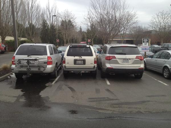 Saw these two at the library, and decided in frustration to park between them.  I'm fairly certain that the guy on the right was completely unable to 