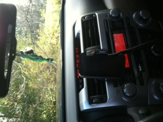 Semi-home made iphone mount that angles toward the driver or faces center, swings 360 for horizontal or vertical viewing, and allows for the charger t