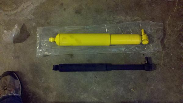 Side by side of the old stabilizer (black) and new Old Man Emu (yellow). The stock one was shot.
