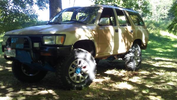 sitting on sticker Cooper Mud Claw MT Radials and 2013 Sequoia Alloys