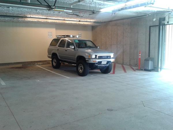 Sitting pretty in the garage, with the custom roof basket i made. My truck didn't come with a roof rack, so i got one from a local toyota part shop.