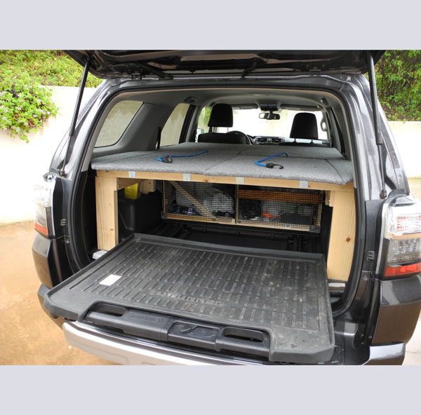 sleeping platform over sliding cargo tray
