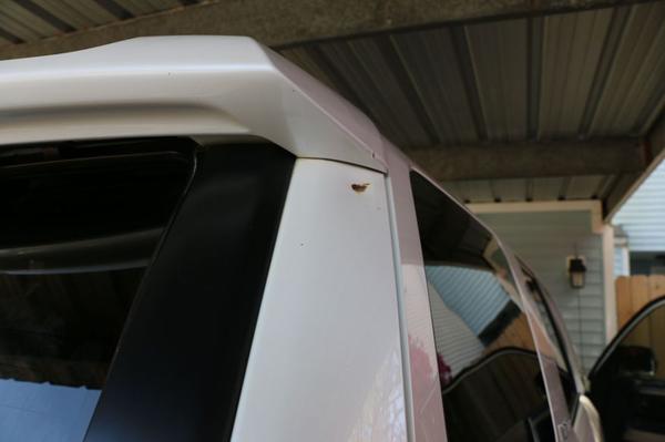 Small dent in rear hatch door;  bike fell from roof rack.  I never repaired it because it wasn't a big deal to me and I initially intended on keeping 