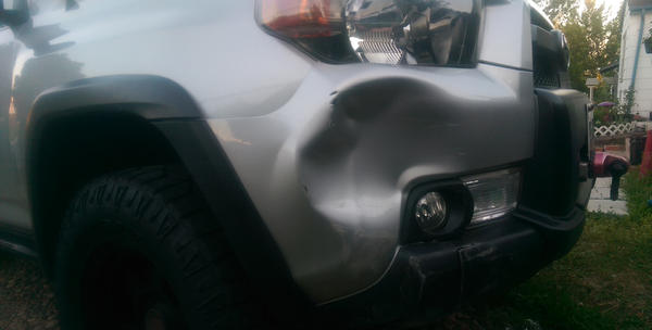 Somebody decided N-B-B was just too purdy and could use some damage. :( This was from "backing into a parking space" next to me.... WTF! On the bright