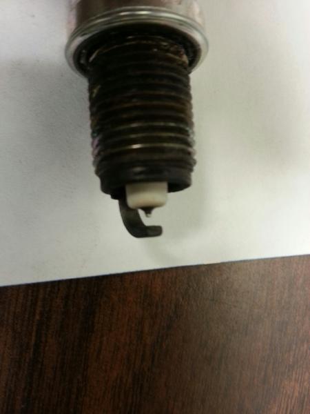 Spark Plug Pic - Typical of all removed - Closeup of electrode - Noticeable wear of electrode compared to new plug