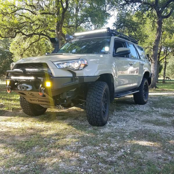 Sporting the new Hefty Fabworks Aluminum front bumper and Warn Zeon Platinum 10s winch.  The baja designs fog lights are AWESOME.